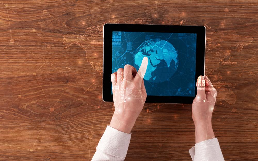 Hand touching tablet with worldwide reports links and statistics concept Hand touching tablet with worldwide reports links and statistics concept